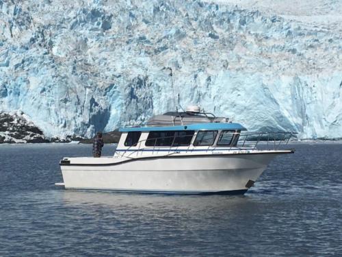 Enukin Boat in front of Aialik Glacier at Kenai Fjords National Park